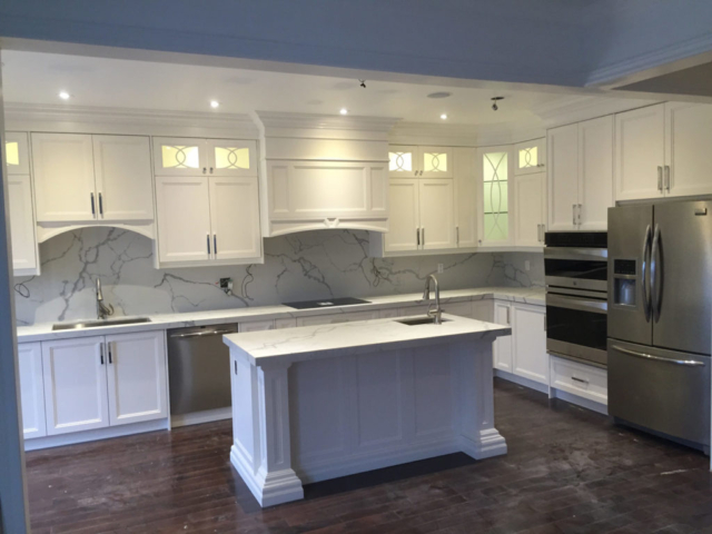 Double Stacked Transitional Kitchen With Off White Painted Mdf Doors Marble Countertops And Backsplash And Center Island With Sink