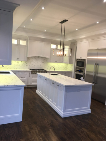 Double Stacked Transitional Kitchen With White Painted Mdf Doors Quartz Countertops And Backsplash And Center Island