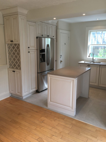 Traditional Kitchen With Glazed Cabinets Quartz Countertops And Wine Rack