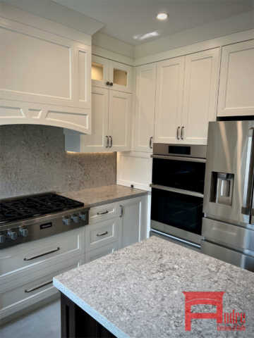 Transitional Kitchen With Painted Mdf, Double Shaker Door Profiles, Island With Natural Oak Wood, Decorative Mantle Hood Design, Quartz Countertops, Pull Out Bin 1