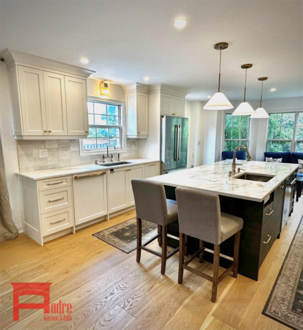 Transitional Kitchen With Painted Mdf, Shaker Door Profiles, Island With Natural Oak Wood And Seating Area, Decorative Mantle Hood With Golden Mirror Design, 3