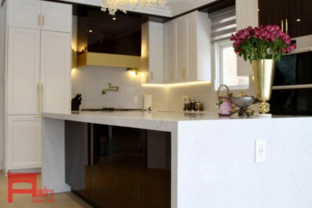 Transitional Kitchen With Painted Mdf And Piano Finish High Gloss Exterior, Quartz Countertop And Backsplash, Waterfall Island, And Custom Mantle Hood With Golden Metallic Frame 2