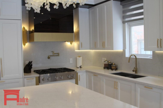 Transitional Kitchen With Painted Mdf And Piano Finish High Gloss Exterior, Quartz Countertop And Backsplash, Waterfall Island, And Custom Mantle Hood With Golden Metallic Frame 3