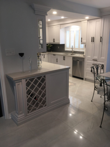 Transitional Kitchen With Light Grey Painted Mdf Doors Quartz Countertops And Wine Rack