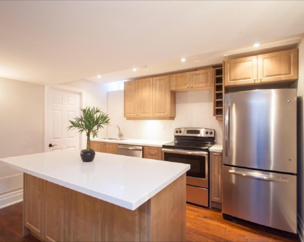 Transitional Kitchen With Raised Panel Thermofoil Doors And Center Island