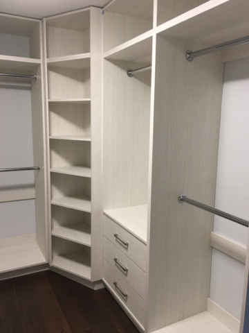 Walk In Closet With Austrian Laminated Cream Coloured Wood