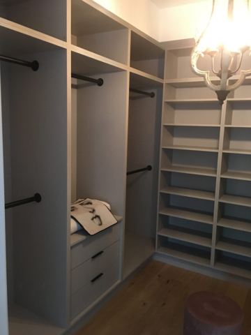 Walk In Closet With Light Grey Austrian Laminate Linen Closet